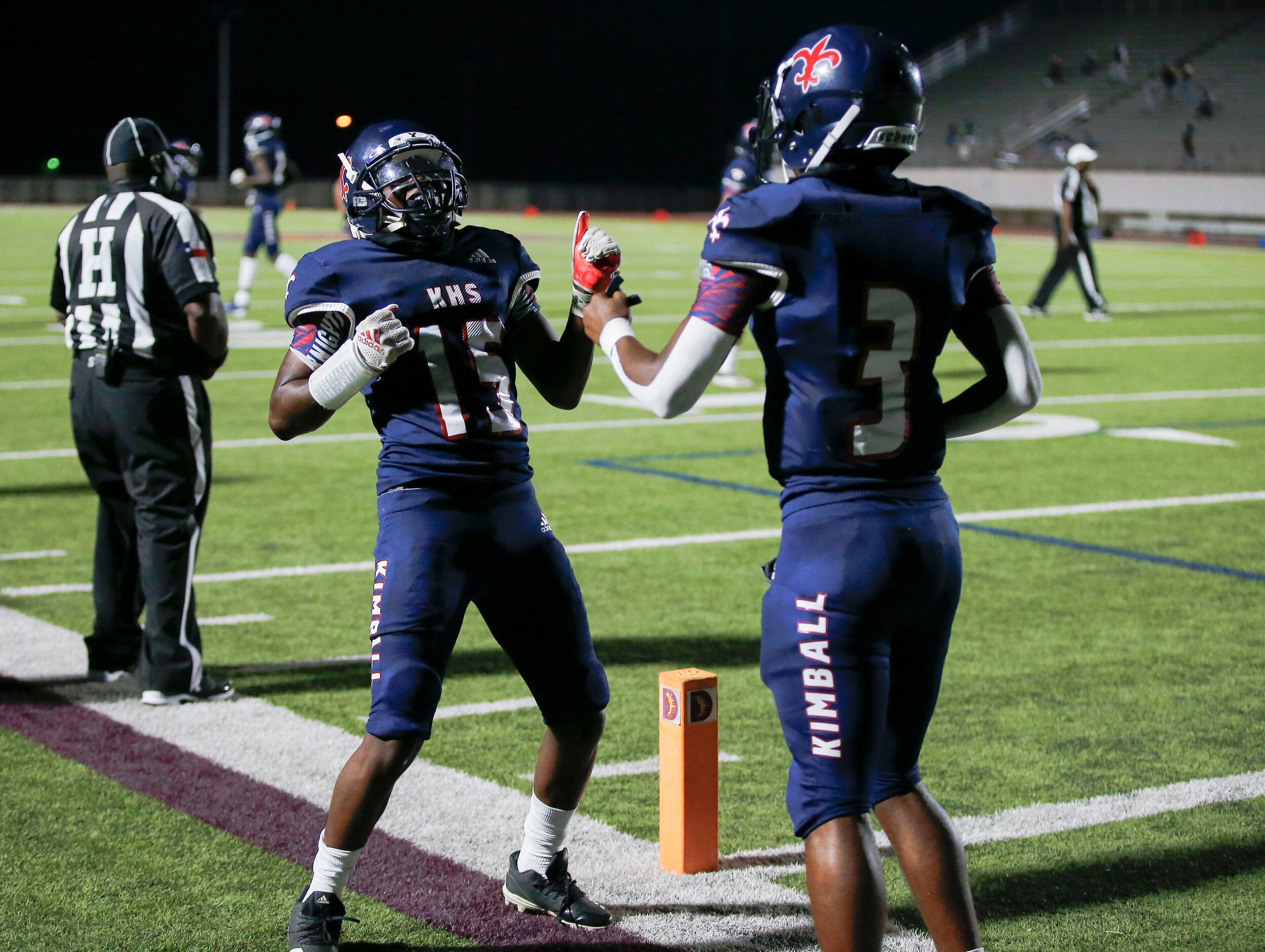 Kimball junior wide receiver Cedric Robertson (15) celebrates scoring a touchdown with...