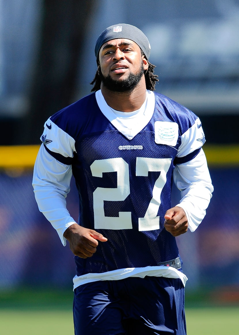 Dallas Cowboys safety J.J. Wilcox runs up the field during NFL football training camp,...