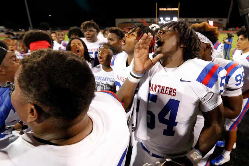 Duncanville's Savion Byrd (54) and his teammates howl after defeating Lancaster, 24-3, at...