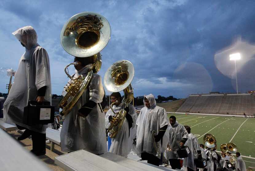 The Garland Lakeview  band exits the stadium along with all those attending the game against...