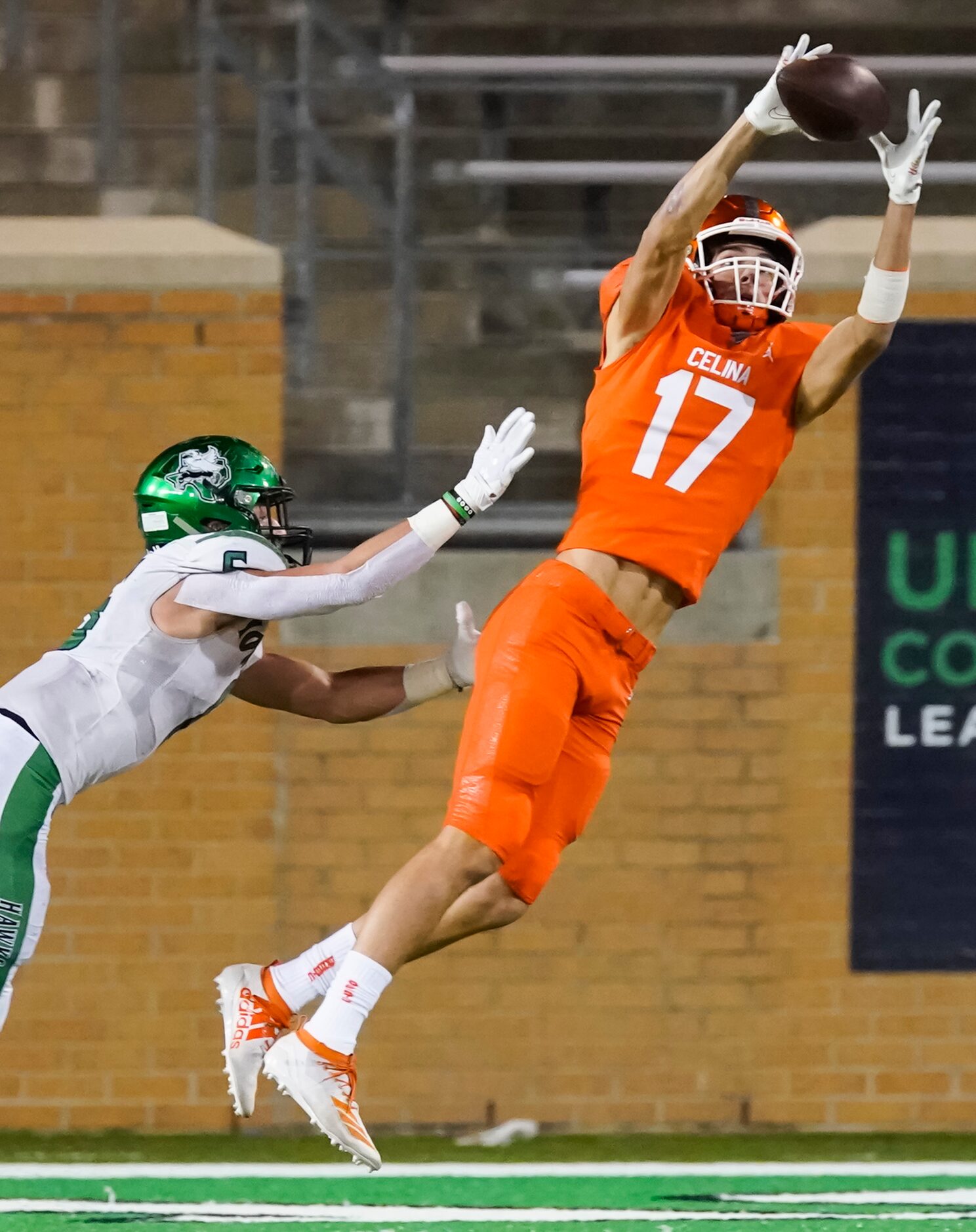 Celina wide receiver DJ Dell'Anno (17) catches a pass over Iowa Park defensive back  Connor...