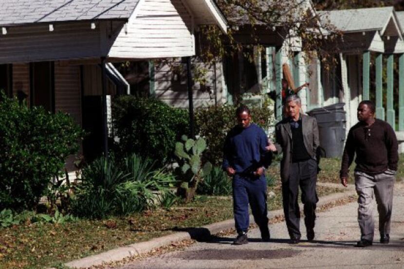 In this 2001 file photo, Don Williams, center, walks with two community activists along a...