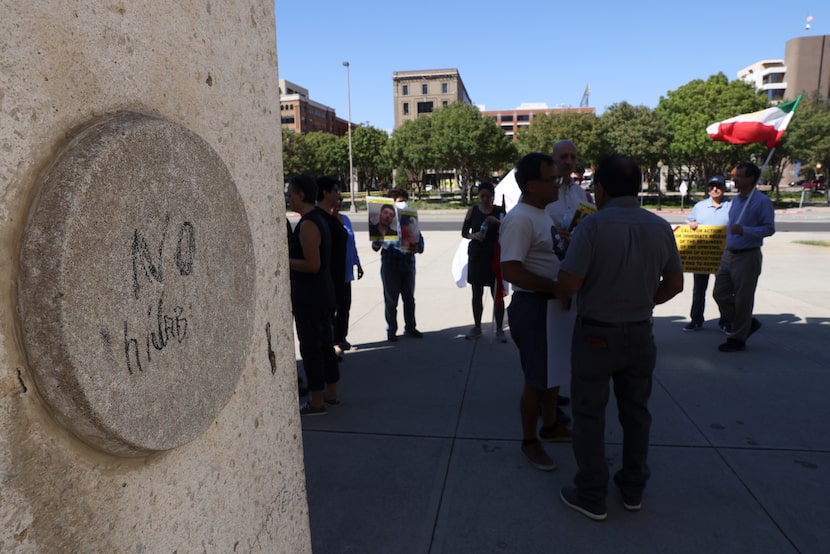 Around 30 people gathered to protest the Iran government, Sunday, Oct. 2, 2022 in Dallas....