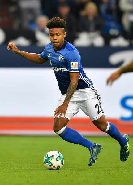 FILE - In this Sept. 10, 2017, file photo, Schalke's Weston McKennie runs for the ball...