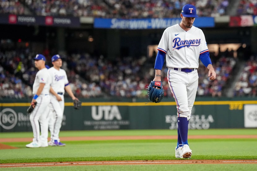 Texas Rangers pitcher Andrew Heaney (44) heads to the clubhouse after getting pulled from...