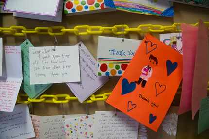 Scores of thank-you cards line the wall that caregivers see once they exit the intensive...