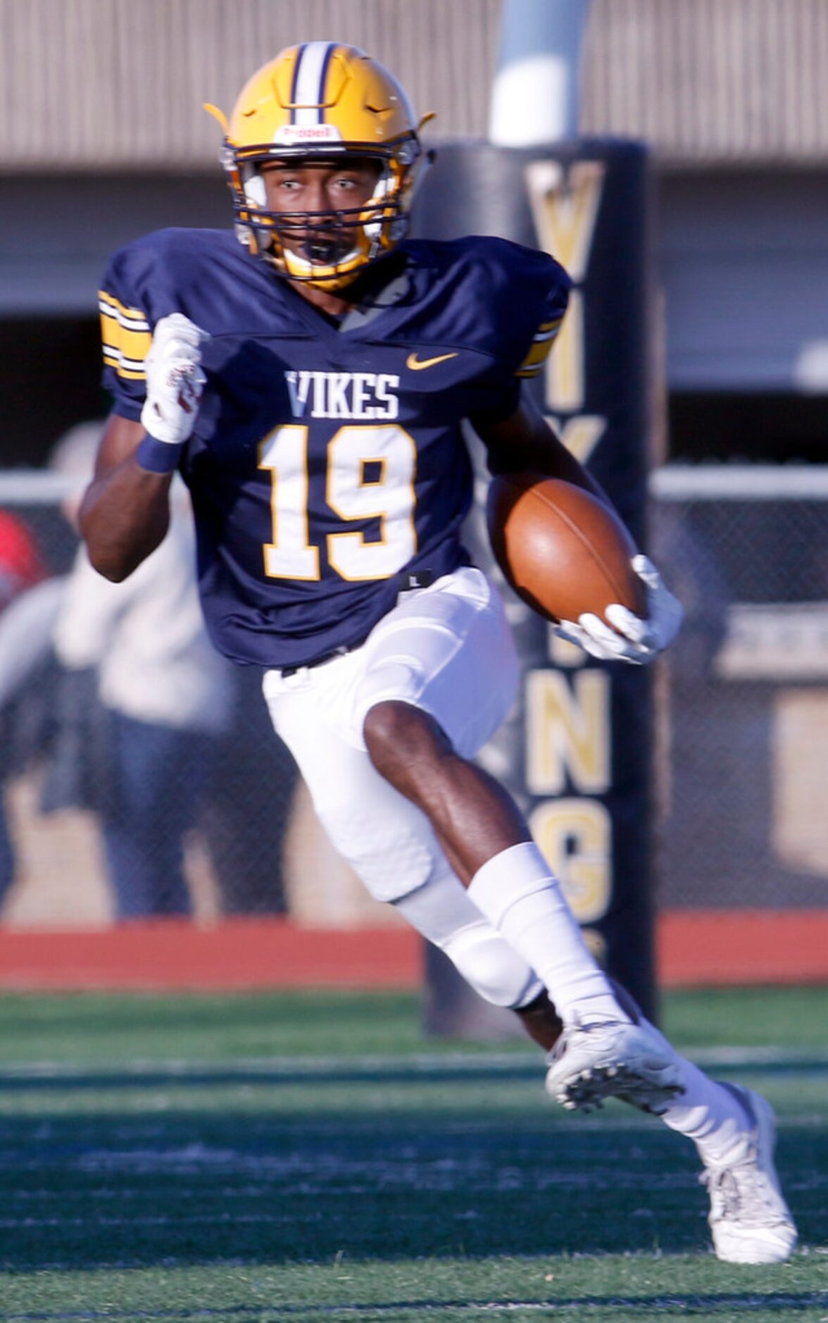 Arlington Lamar receiver Trevon West (19) looks for a running lane as he returns a kickoff...