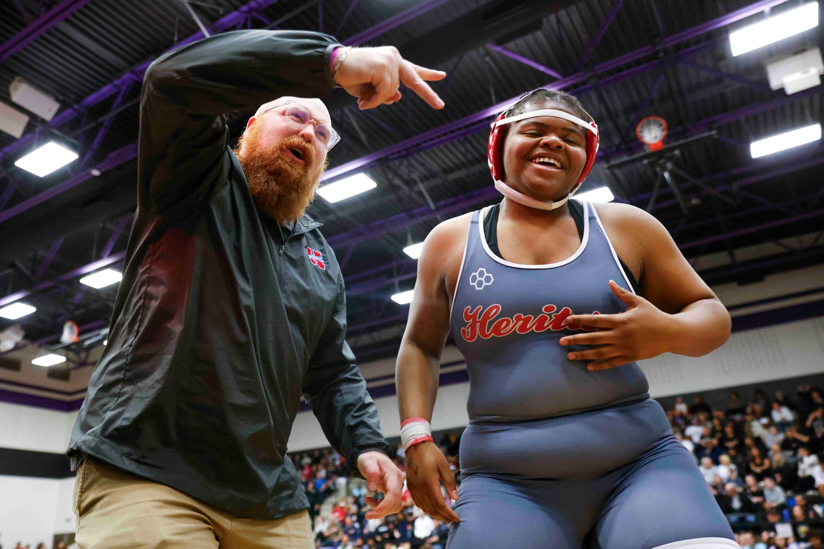 Colling Stroner head coach of Midlothian Heritage cheer with Kendall Jones over her victory...