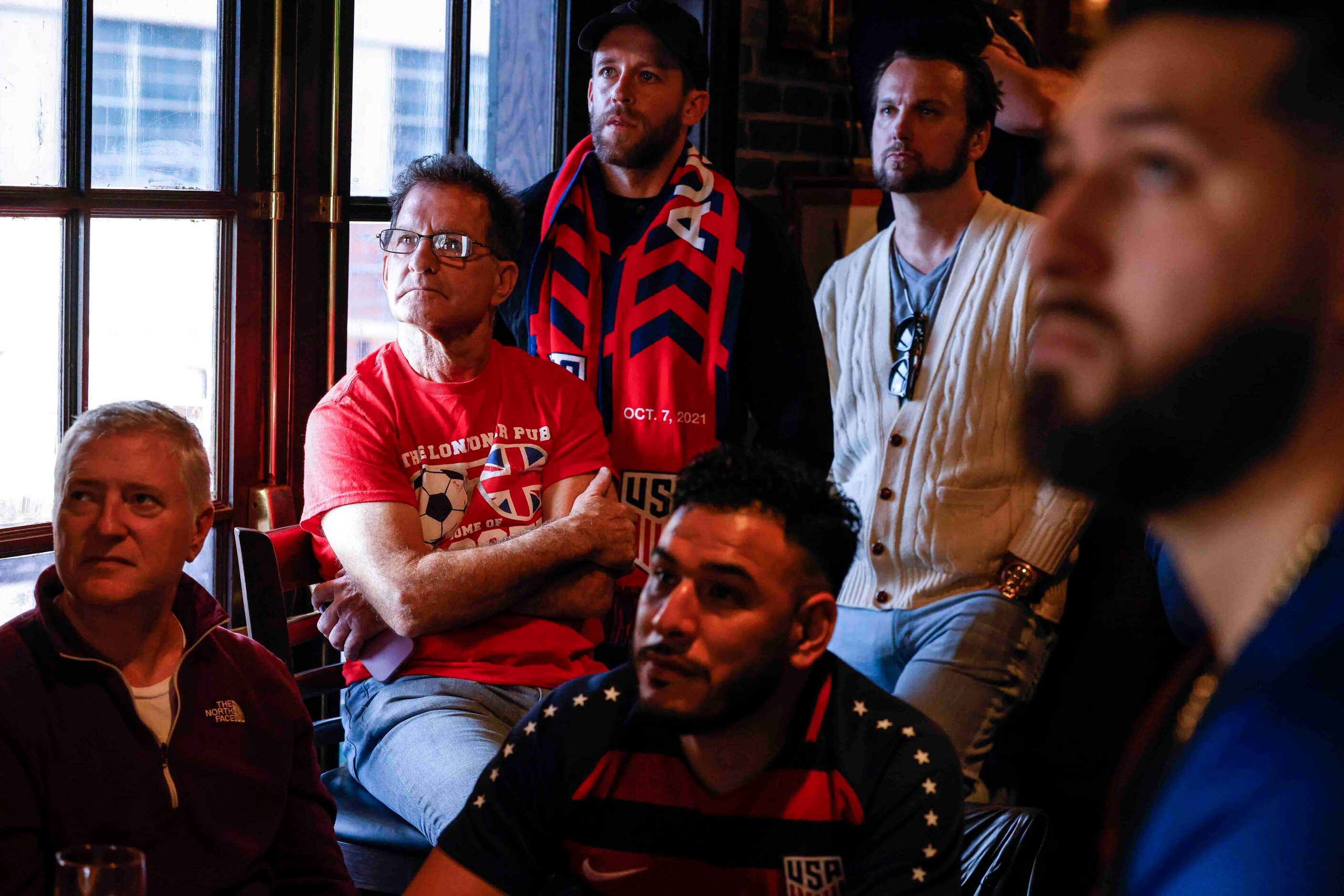 England and USA soccer fans watch the game during a World Cup watch party at the Londoner...