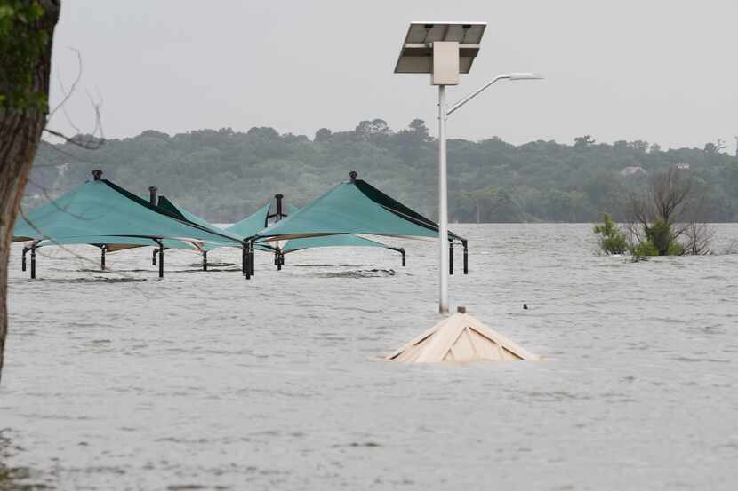 Tops of pavilions sticking out of high water at a closed Murrell Park on the north shore of...