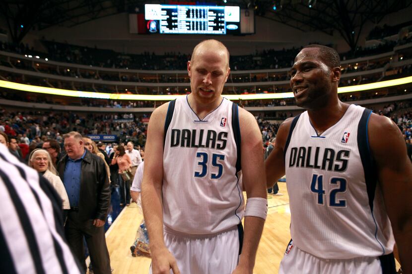 Dallas Mavericks center Chris Kaman (35) and Dallas Mavericks power forward Elton Brand (42)...