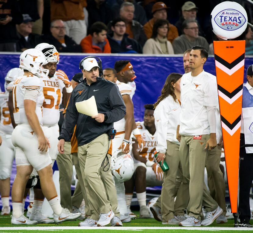 Texas head coach Tom Herman paces the sideline during the first quarter of the Texas Bowl...