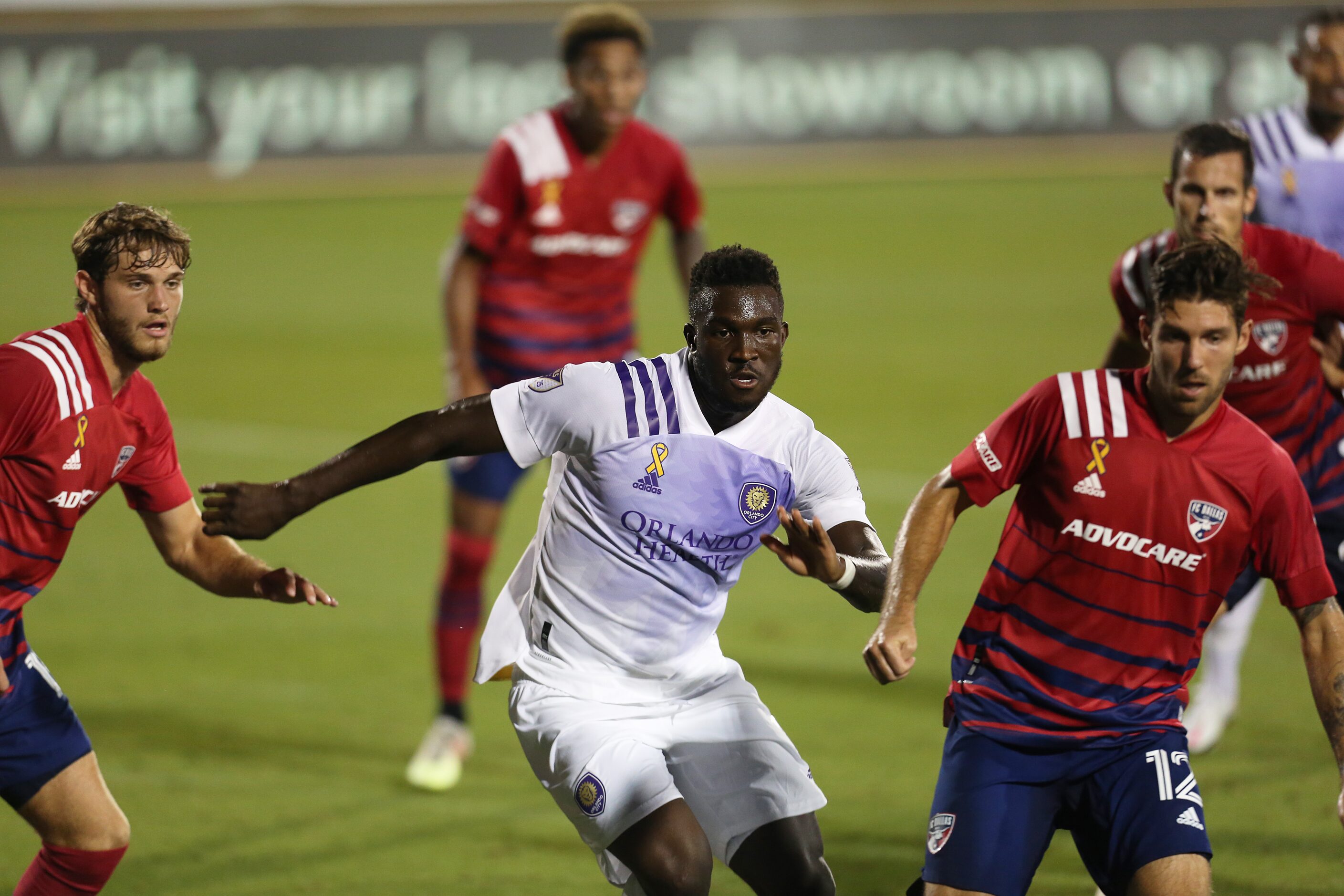 FRISCO, TX - SEPTEMBER 27: Daryl Dike #18 of Orlando City and Ryan Hollingshead #12 of FC...