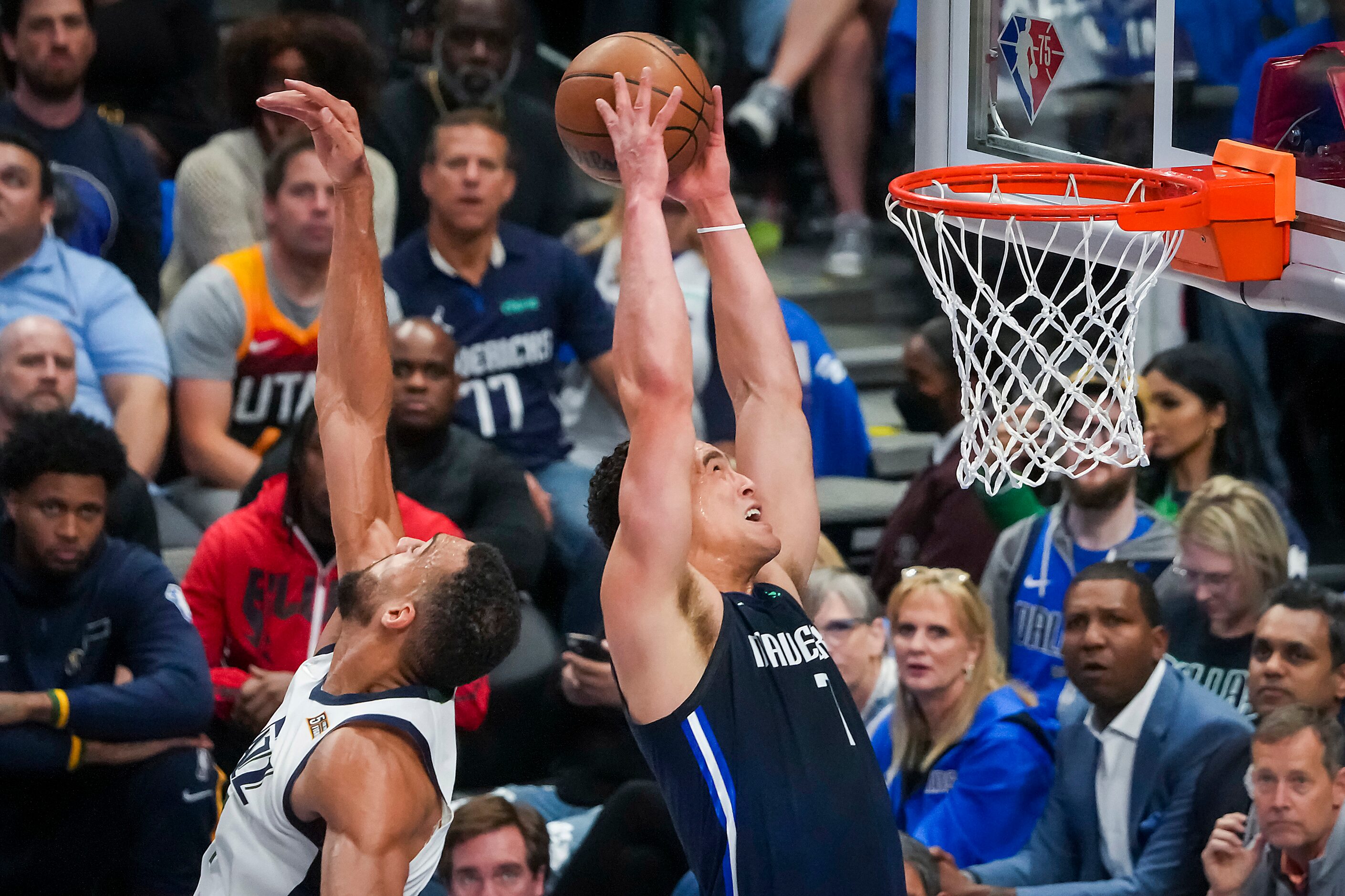 Dallas Mavericks center Dwight Powell (7) dunks the ball past Utah Jazz center Rudy Gobert...