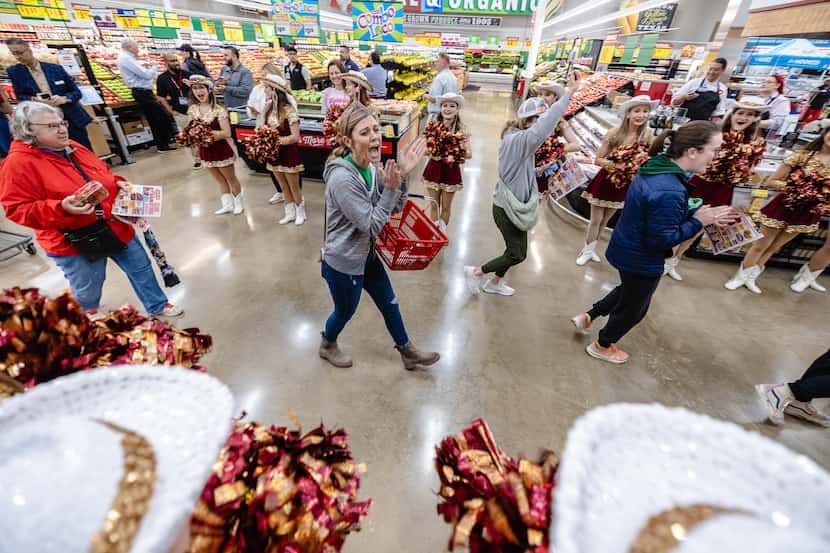 Shoppers who arrived early and waited in line walked into their new neighborhood H-E-B store...
