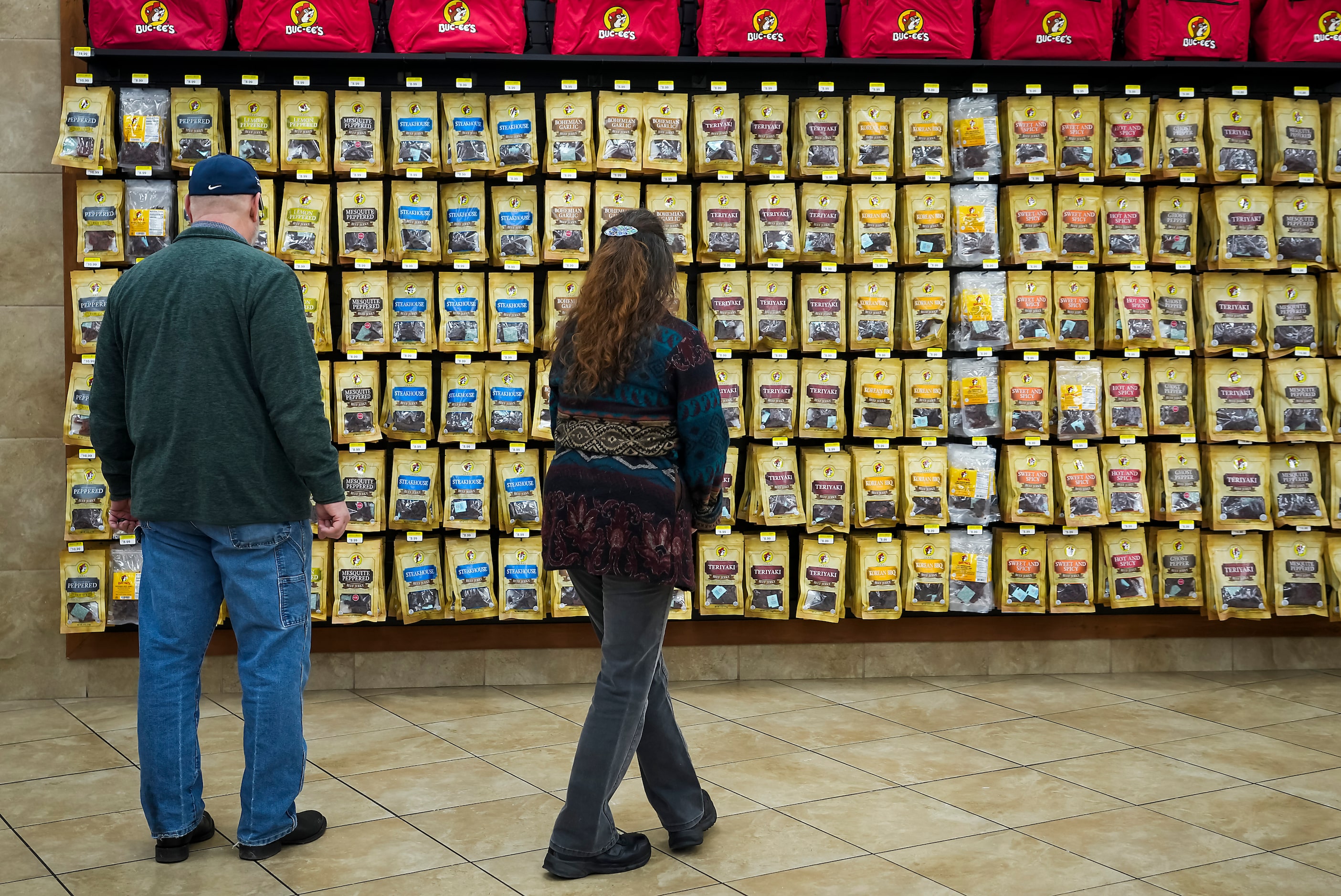 Eric and Kimberly Olesen from Noble, Oklahoma check out snack options during a pit stop at...