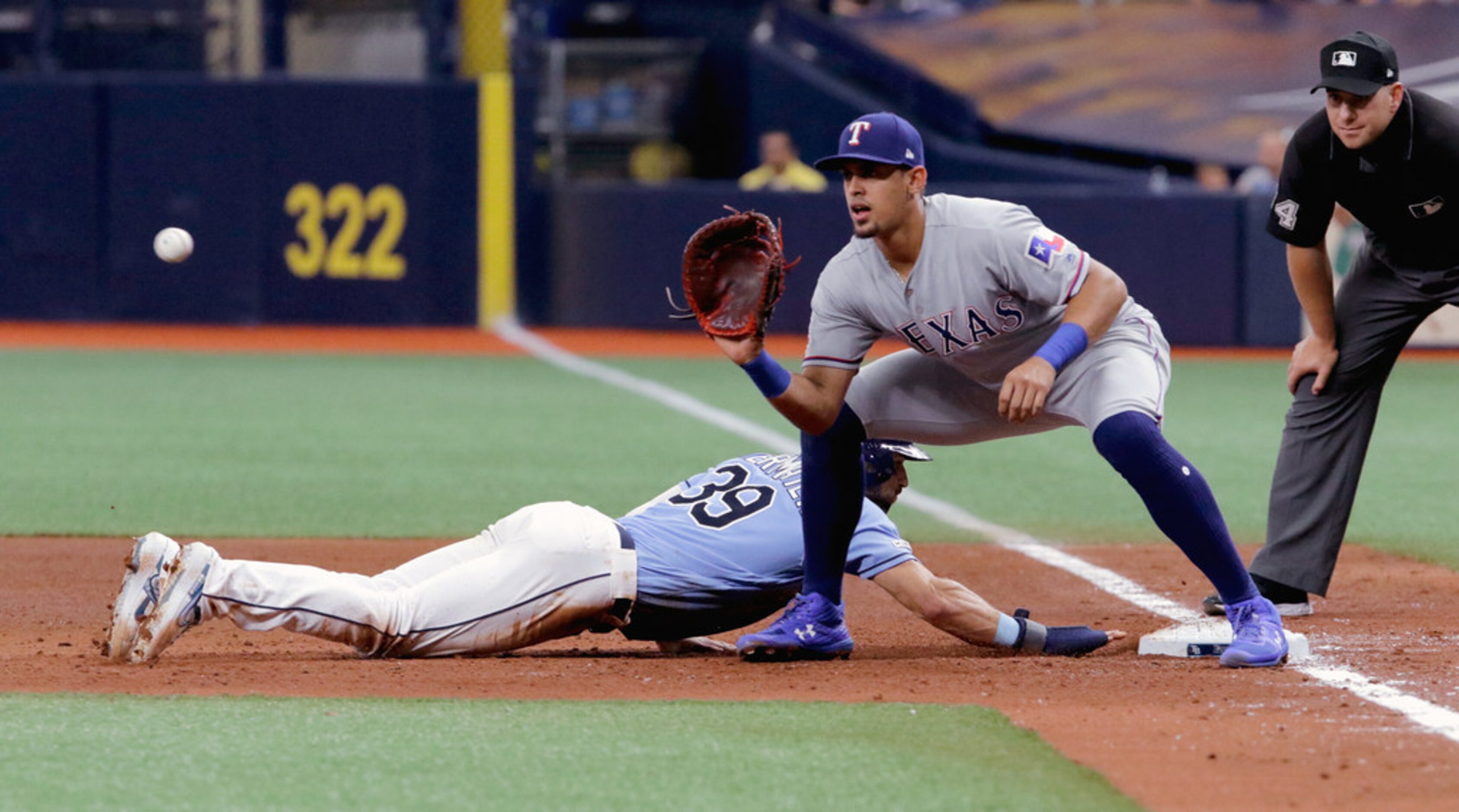 ST. PETERSBURG, FL - JUNE 30:  Kevin Kiermaier #39 of the Tampa Bay Rays dives back to first...