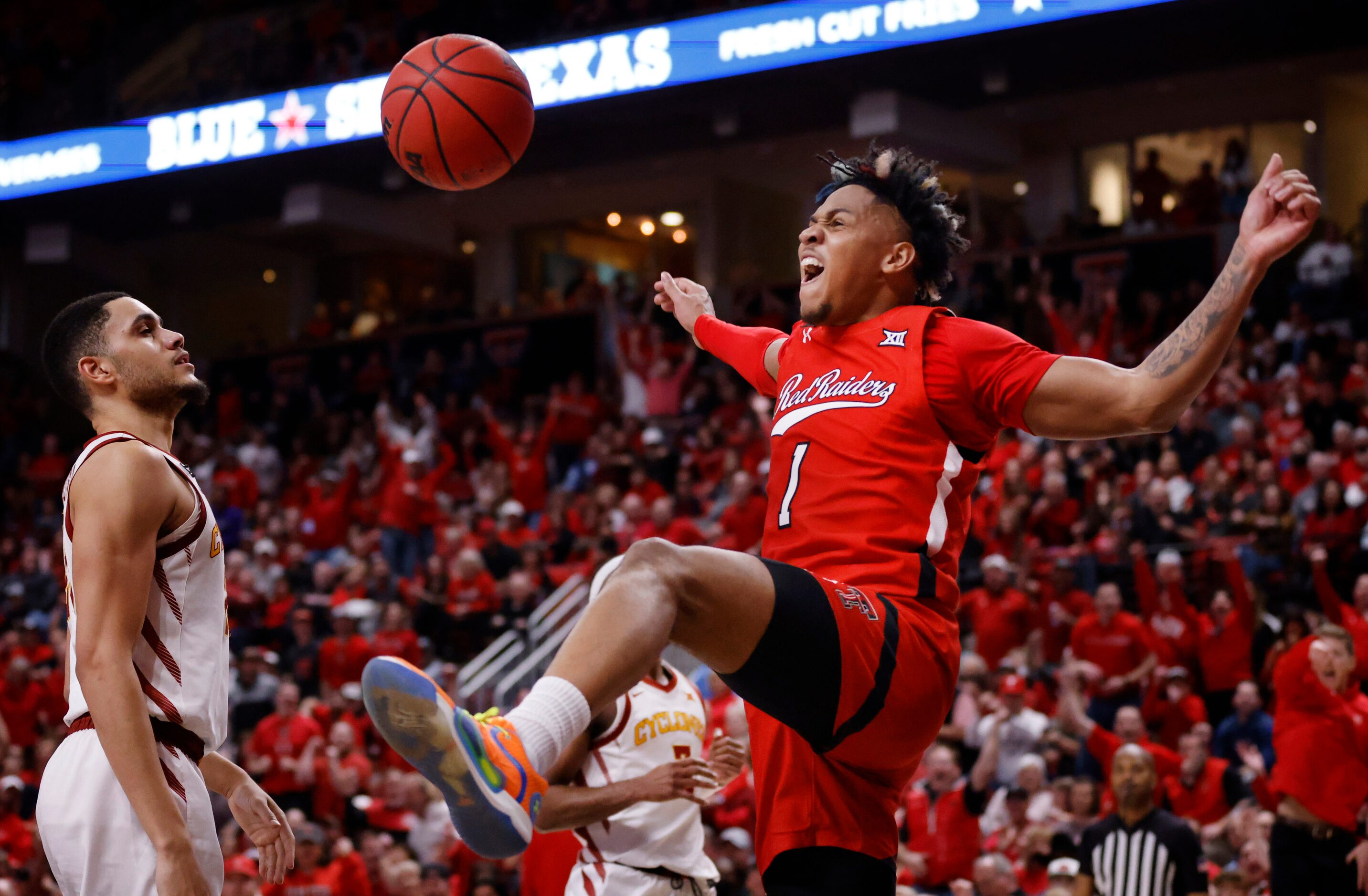 Texas Tech Red Raiders guard Terrence Shannon Jr. (1) completes the alley-oop dunk during...