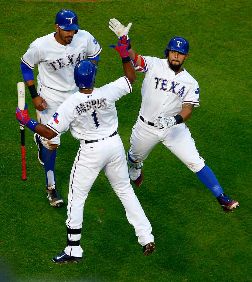  Texas Rangers second baseman Rougned Odor (right) is congratulated by teammate Elvis Andrus...