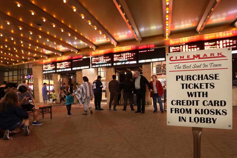 Customers purchase tickets at a Cinemark movie theater in Plano, TX, on Dec. 2, 2017. (Jason...