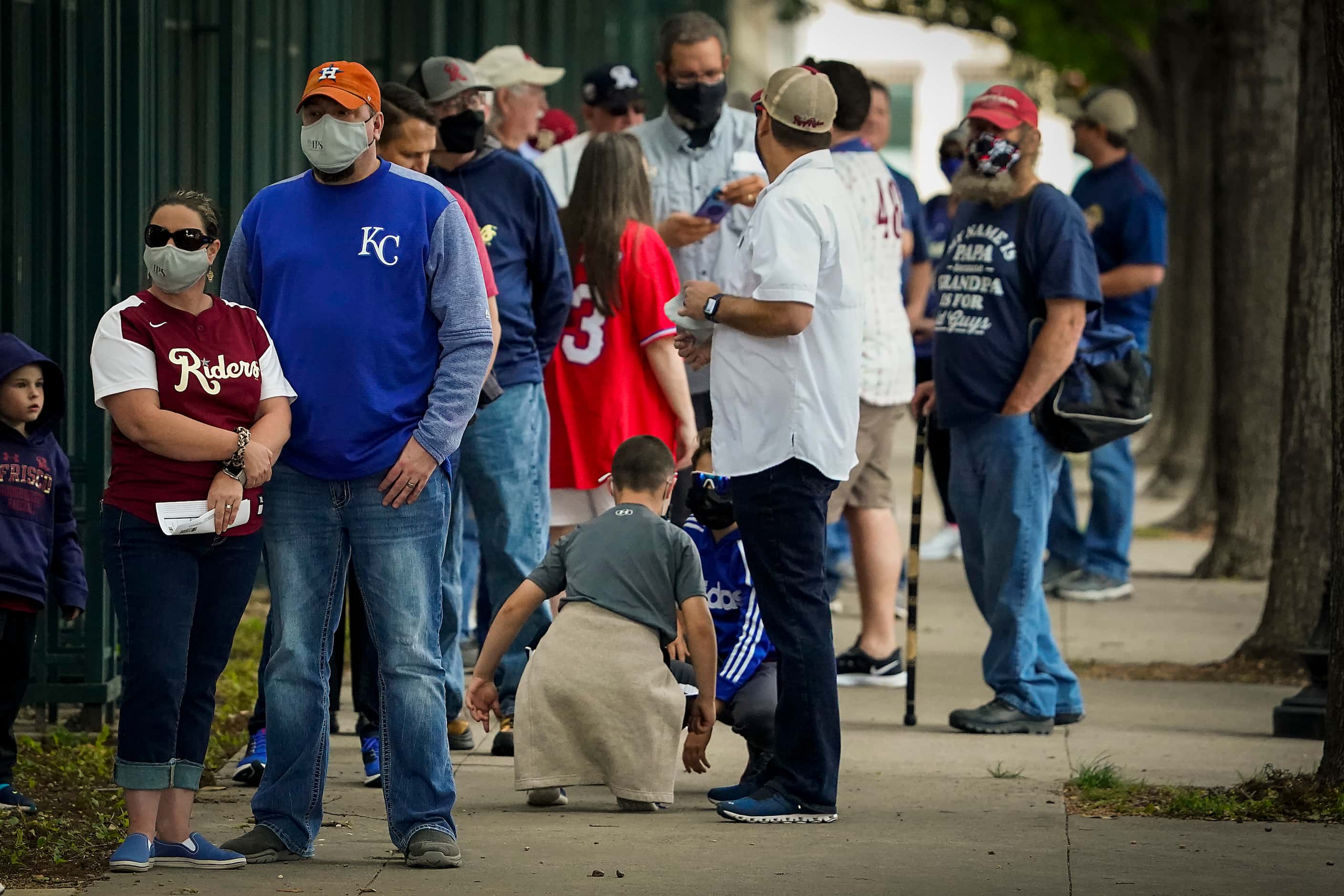 Fans wait for the gates to open before the Frisco RoughRiders season opener against the...
