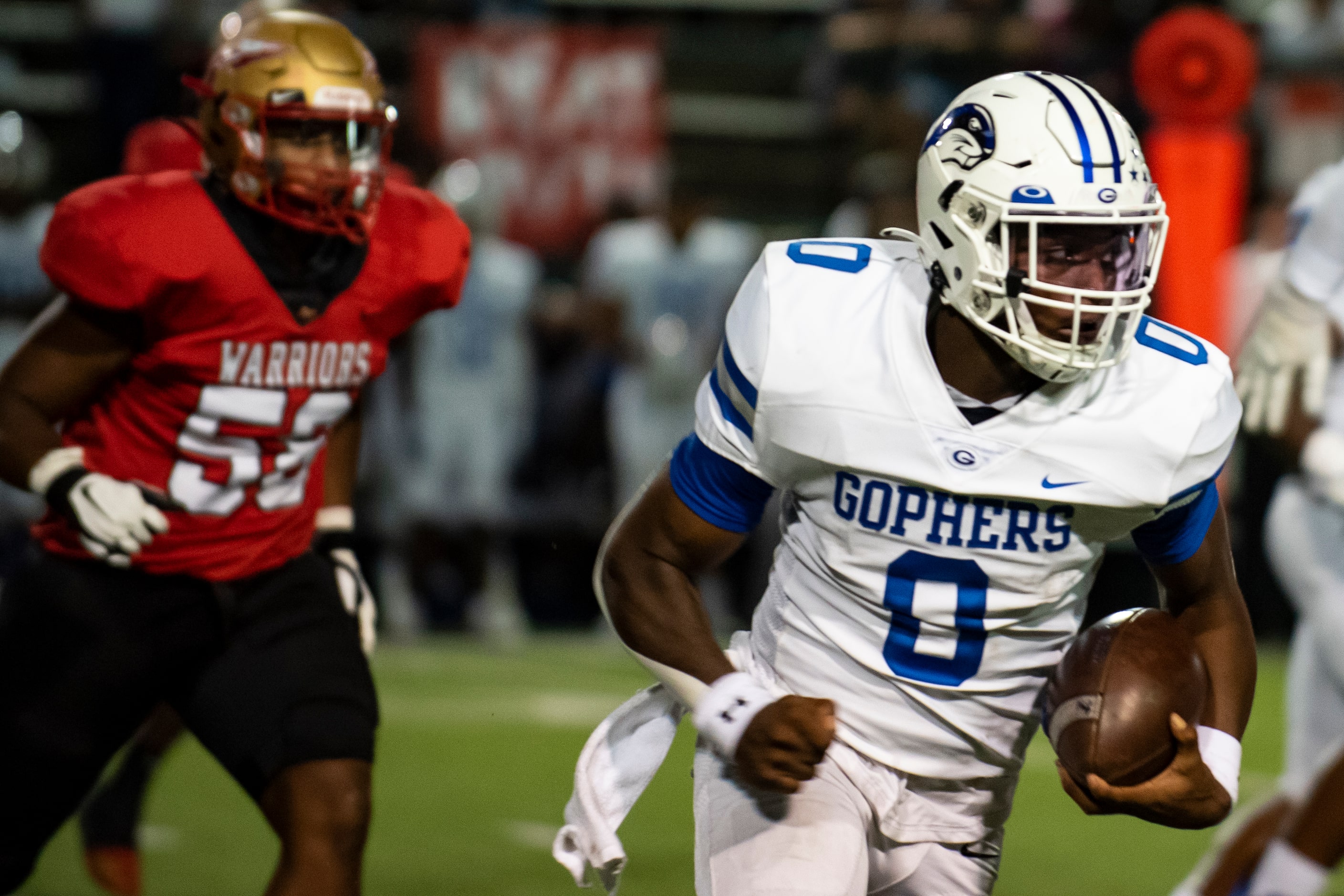 Grand Prairie senior Savion Red (0) runs past a South Grand Prairie junior Marko De La Pena...