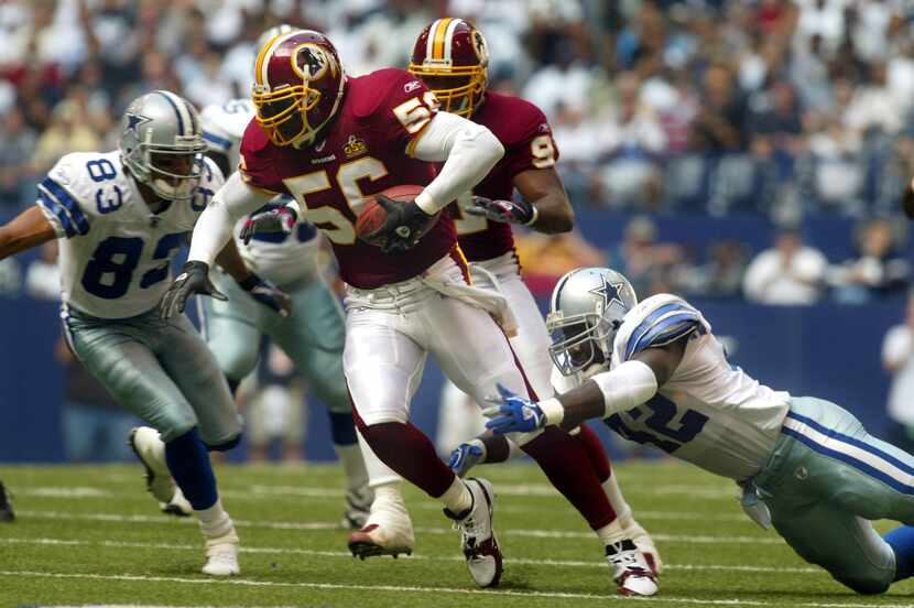 11/2/03: Cowboys running back Troy Hambrick (42) tries make the tackle after giving up a...