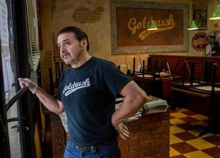 Goldrush Cafe owner George Sanchez looks outside his window on March 16, 2020. The...