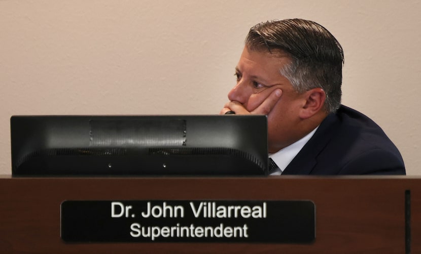 Rockwall ISD Superintendent John Villarreal listens intently to the message from Corey Booth...