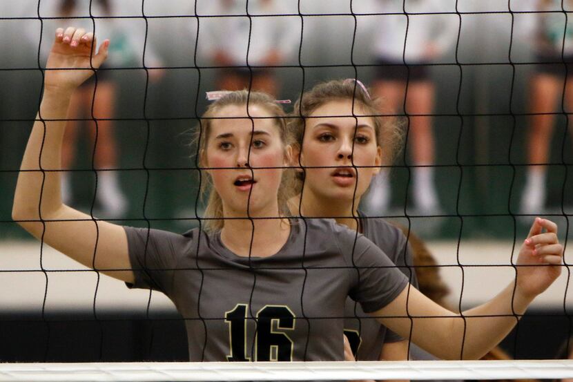 Mansfield's Taylor Fanning (16) and Molly Phillips (20) await a serve in a recent match....