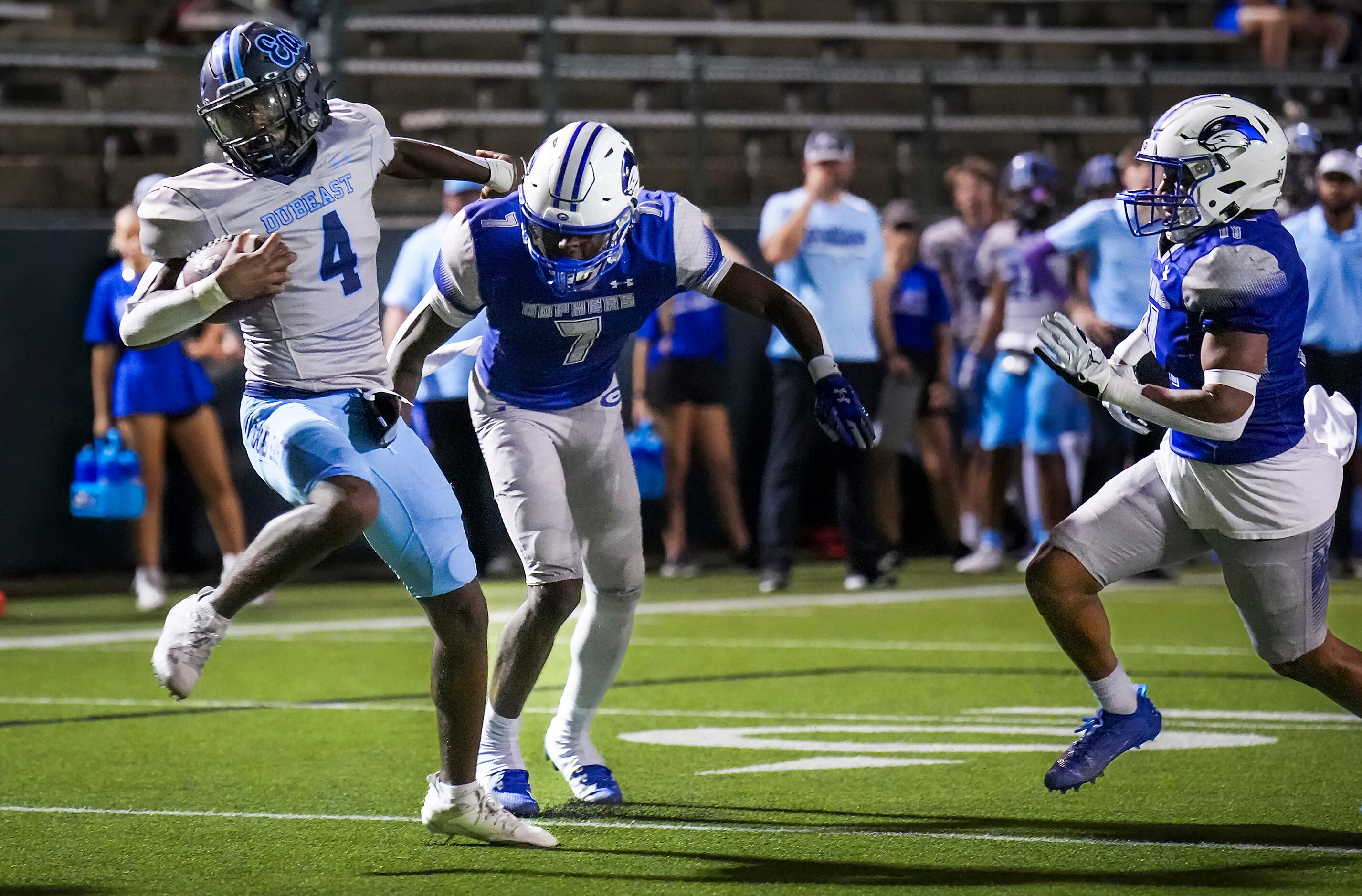 Wylie East quarterback Howard Fisher IV (4) spins past Grand Prairie defensive back Saquion...