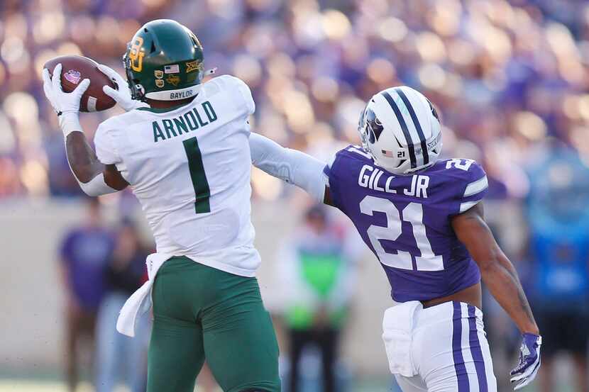Baylor cornerback Grayland Arnold (1) grabs a pass intended for Kansas State wide receiver...