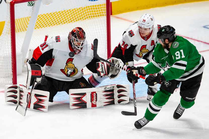 Ottawa Senators goaltender Anders Nilsson (31) blocks a shot attempt by Dallas Stars center...
