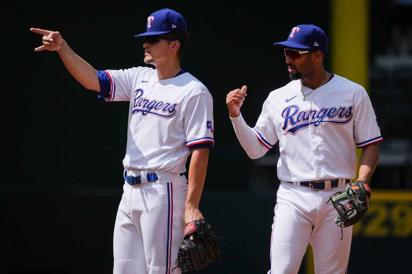 Texas Rangers second baseman Marcus Semien (right) and shortstop Corey Seager (5) are two of...