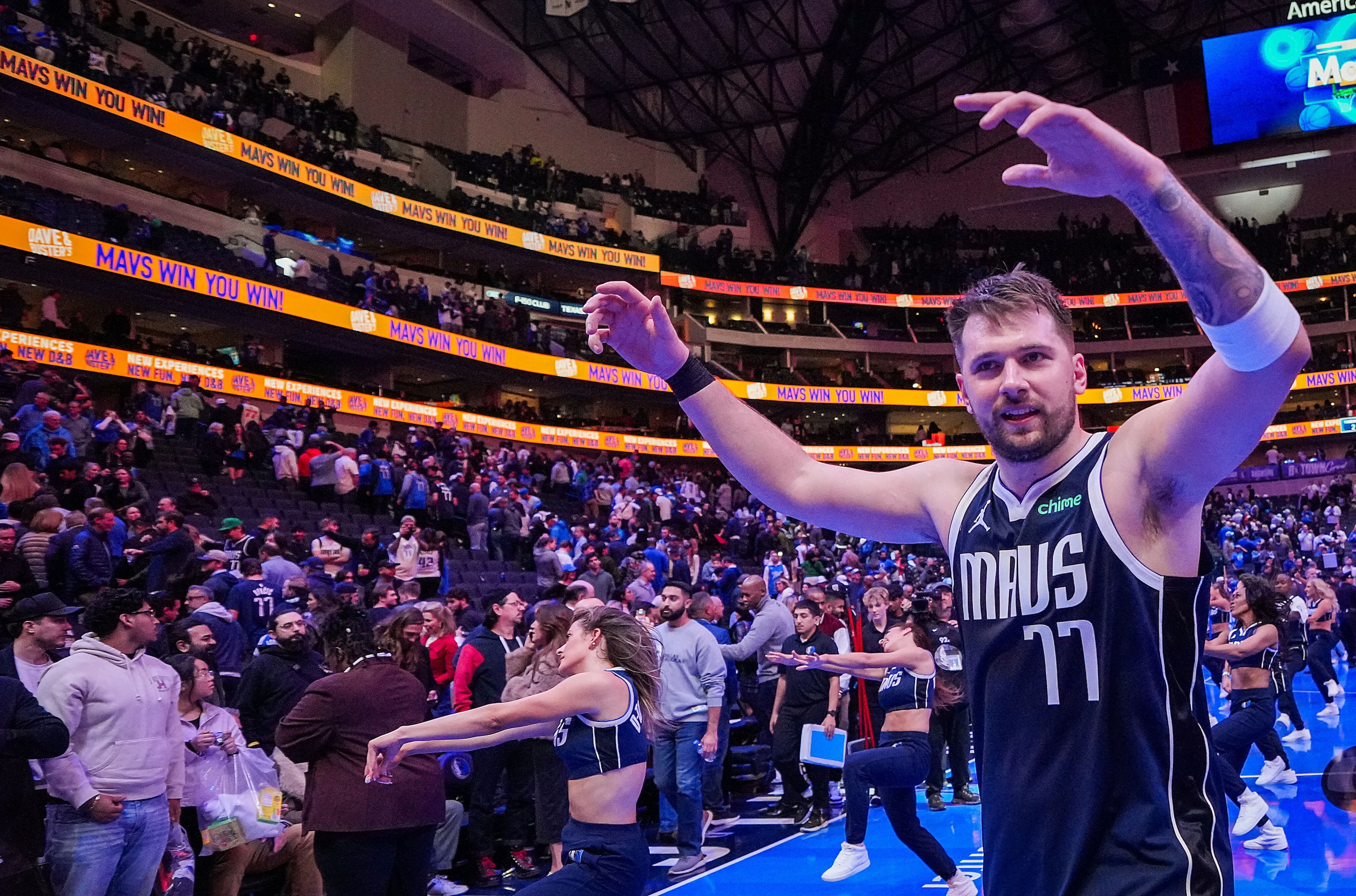 Dallas Mavericks guard Luka Doncic celebrates as he leaves the court after the Mavericks...