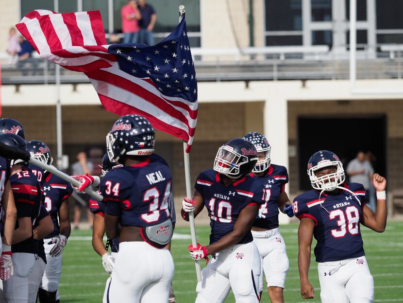 The Ryan High School football takes the field before they play their opponent, Monterey at...