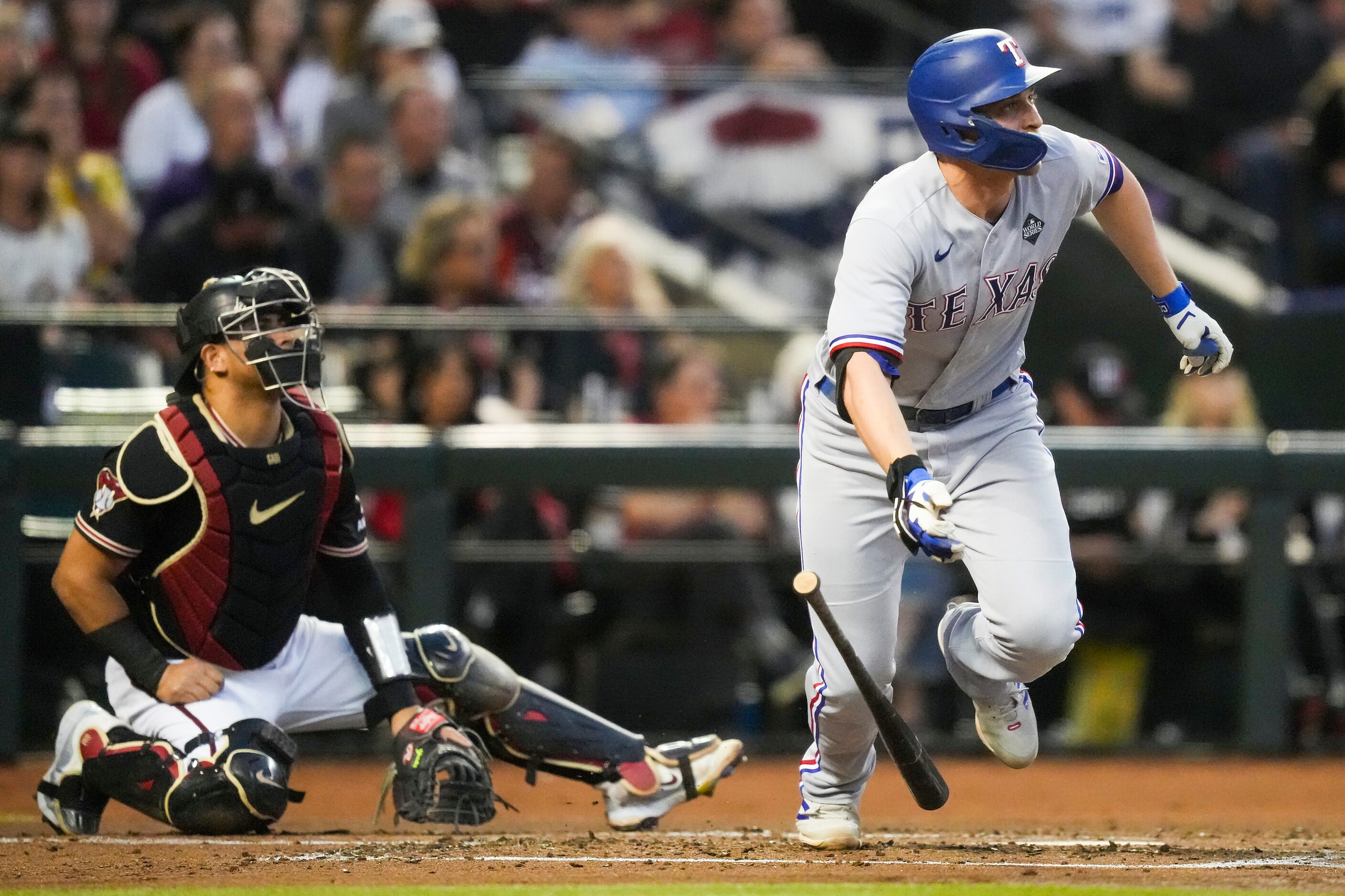 Texas Rangers shortstop Corey Seager hits a solo home run during the second inning in Game 4...