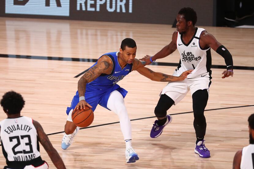 Dallas Mavericks guard Trey Burke (32) drives against Los Angeles Clippers guard Reggie...