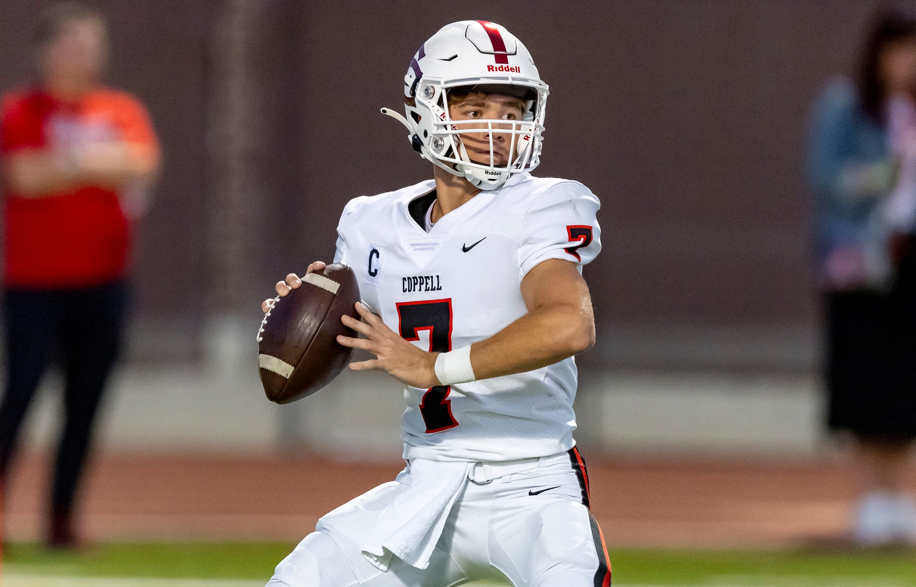 Coppell senior quarterback Jack Fishpaw (7) throws during the first half of a high school...