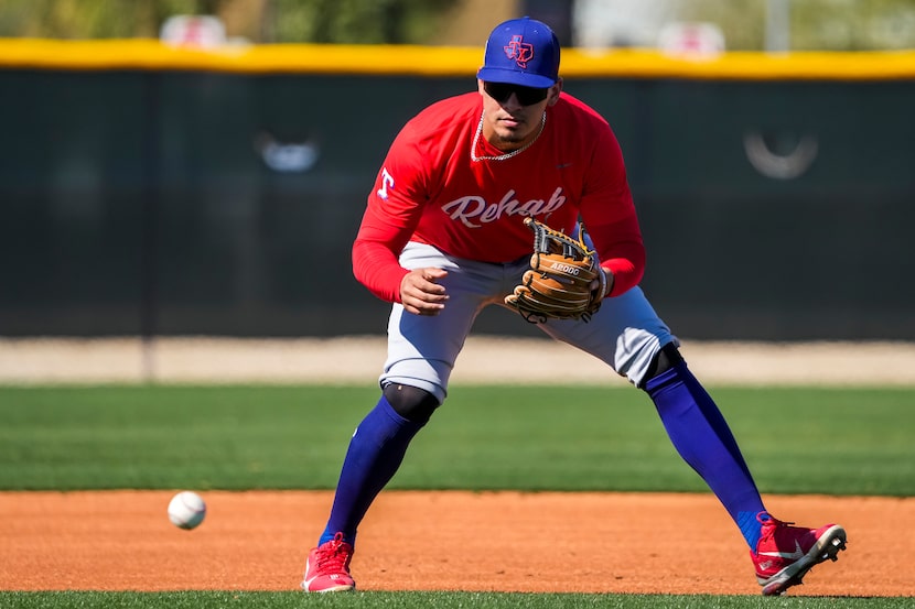 Infielder Chris Seise fields a grounder at shortstop during a Texas Rangers minor league...