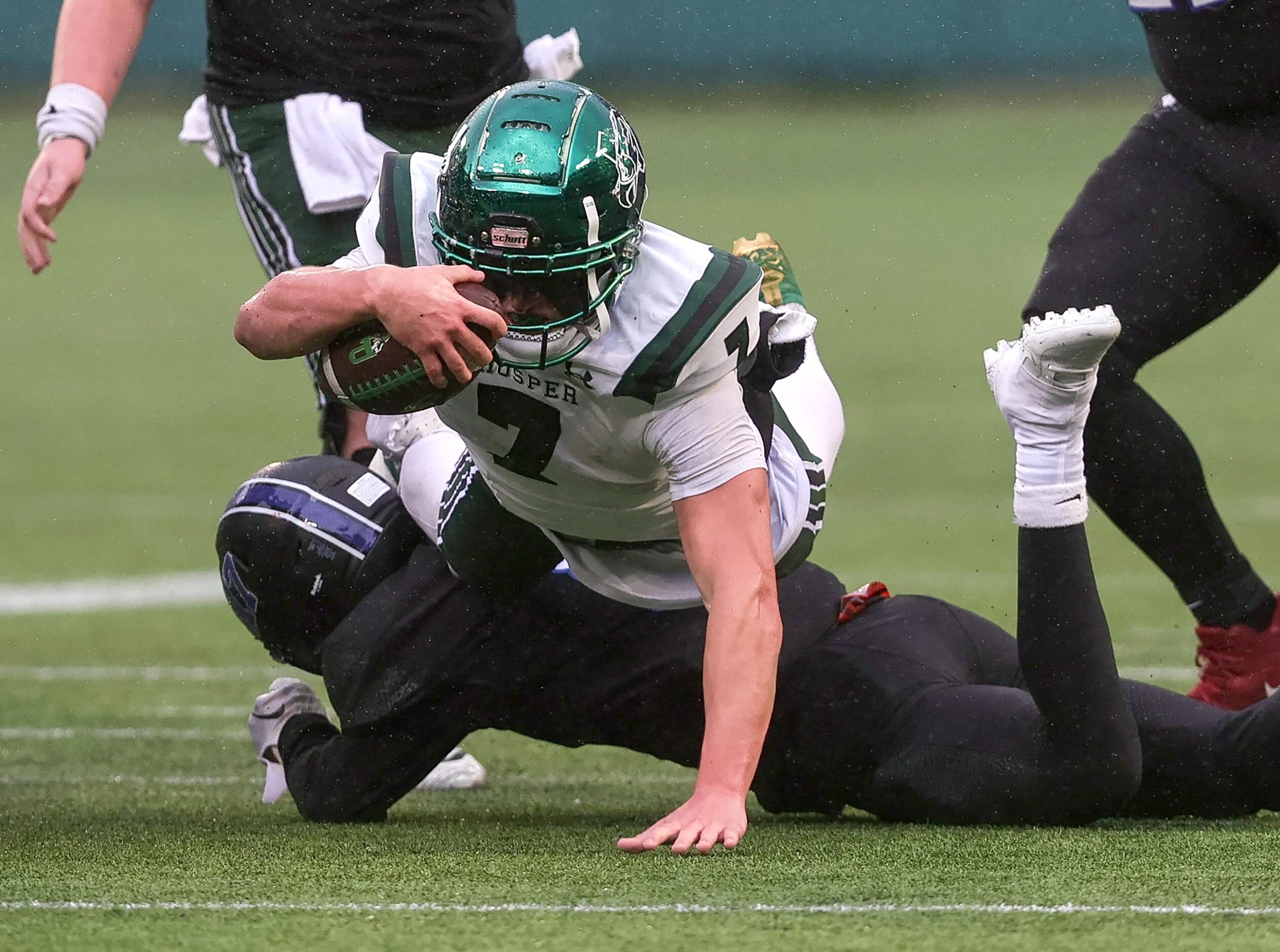 Prosper half back Brayden Rymer (7) dives over North Crowley safety Joshua Nealey for a...