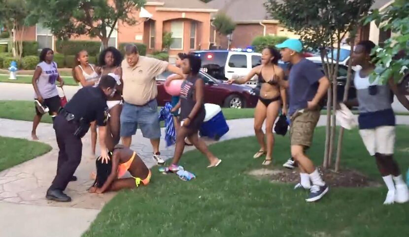 
In an image from a video posted online, McKinney Cpl. Eric Casebolt is seen leaning on a...