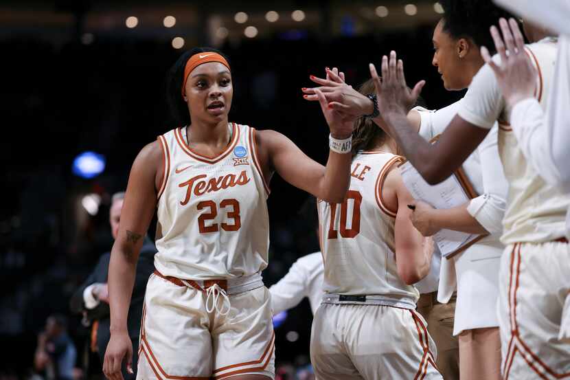 Texas forward Aaliyah Moore (23) celebrates with teammates after the team's win over Gonzaga...