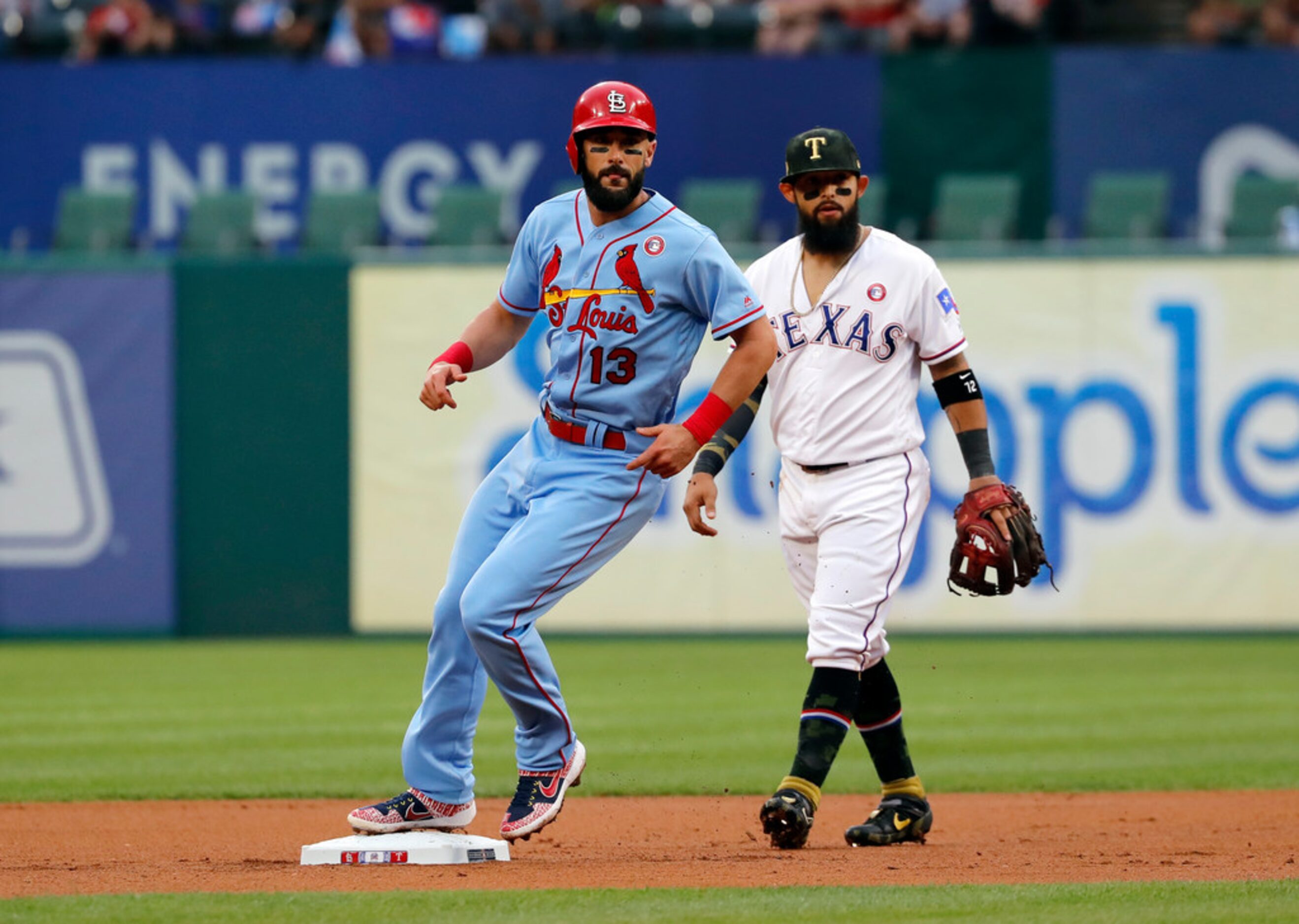 St. Louis Cardinals' Matt Carpenter (13) advances to second on a wild pitch as Texas...