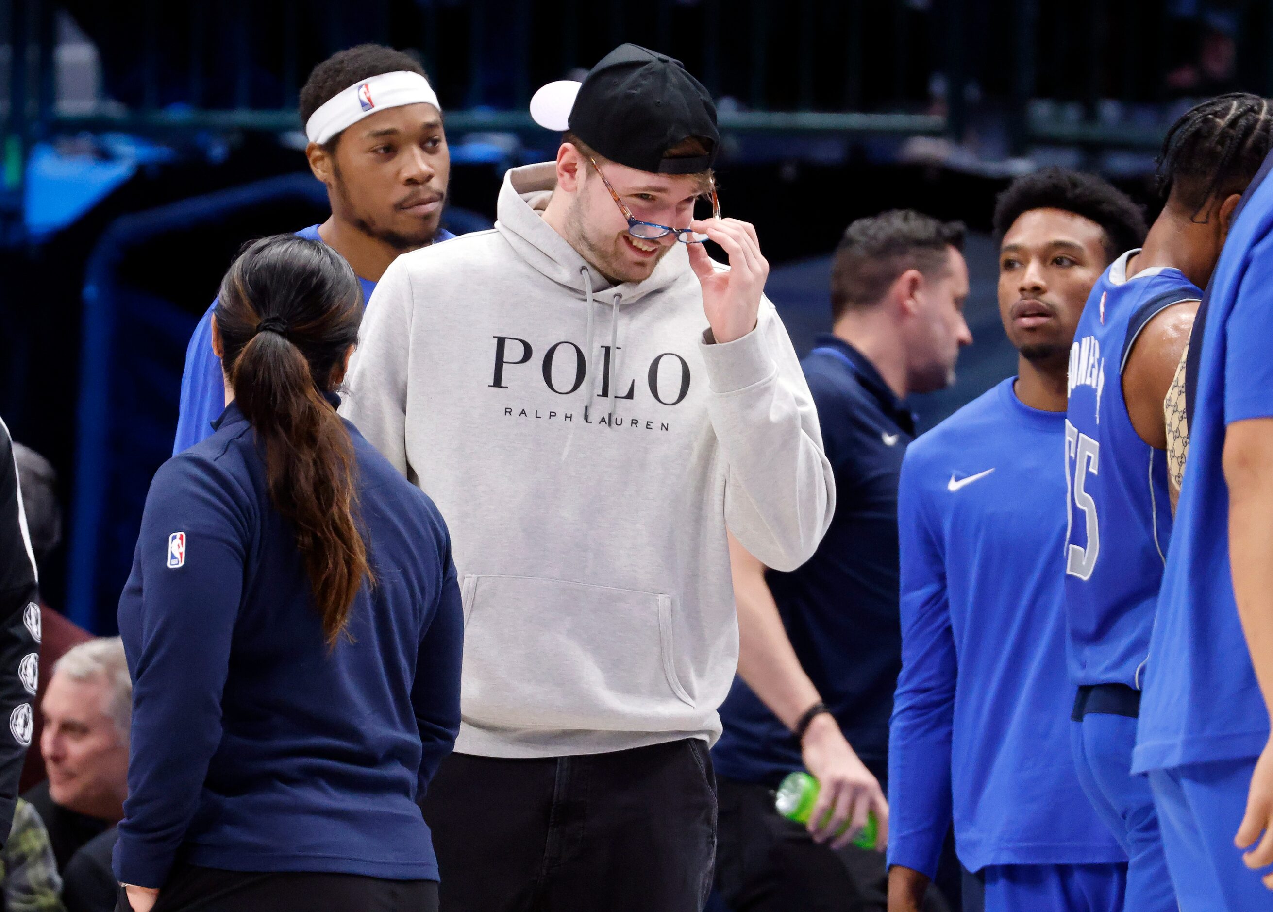 Dallas Mavericks guard Luka Doncic (77) put on a pair of someone else’s glasses during a...