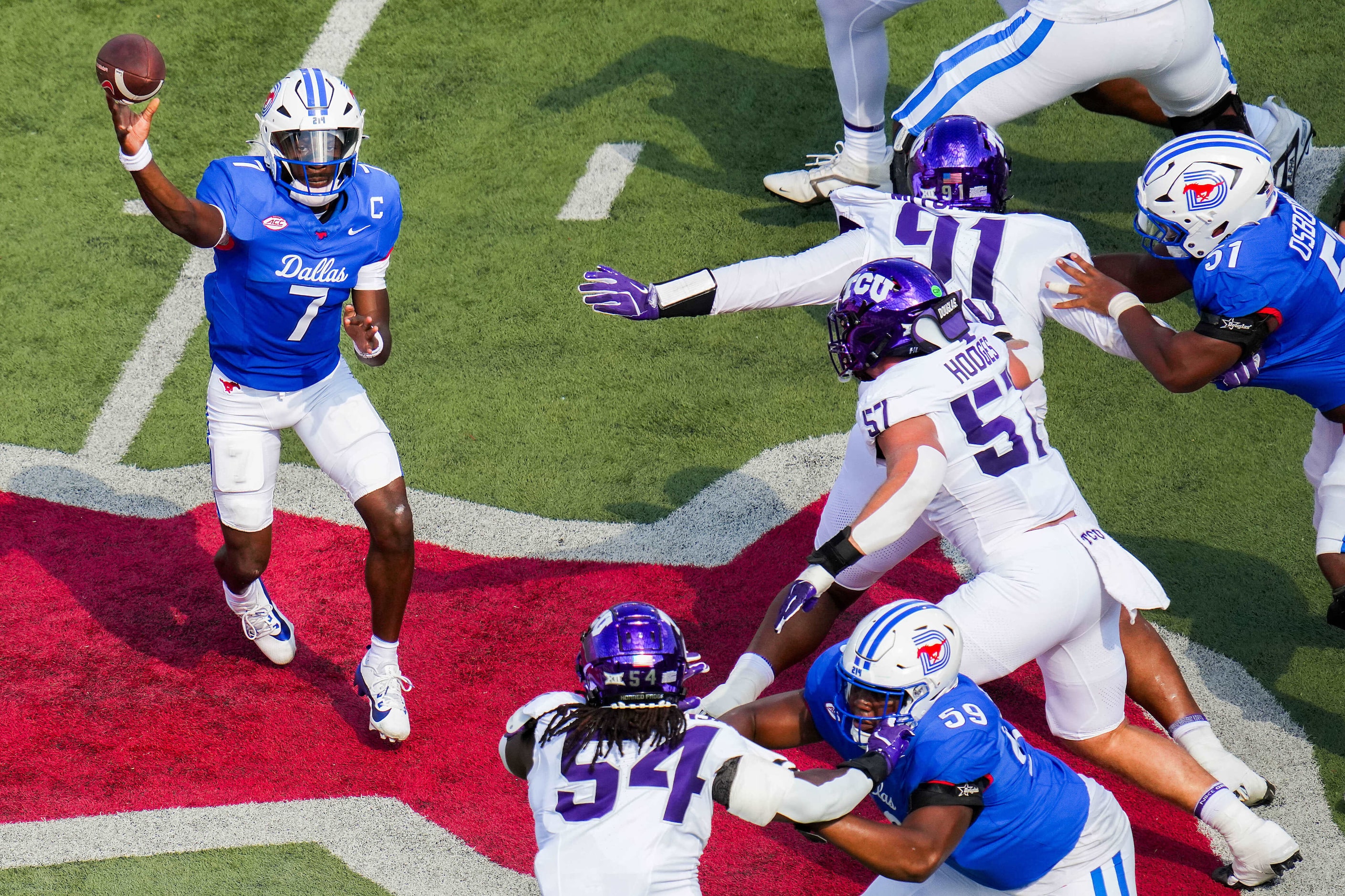 SMU quarterback Kevin Jennings (7) throws a pass during the first half of an NCAA football...