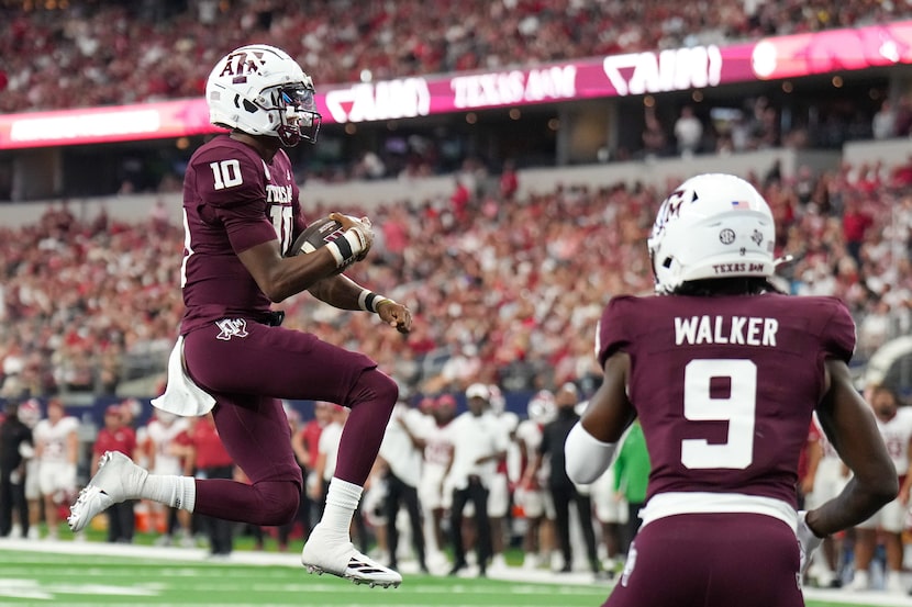 Texas A&M quarterback Marcel Reed (10) leaps into the end zone on a touchdown run during the...