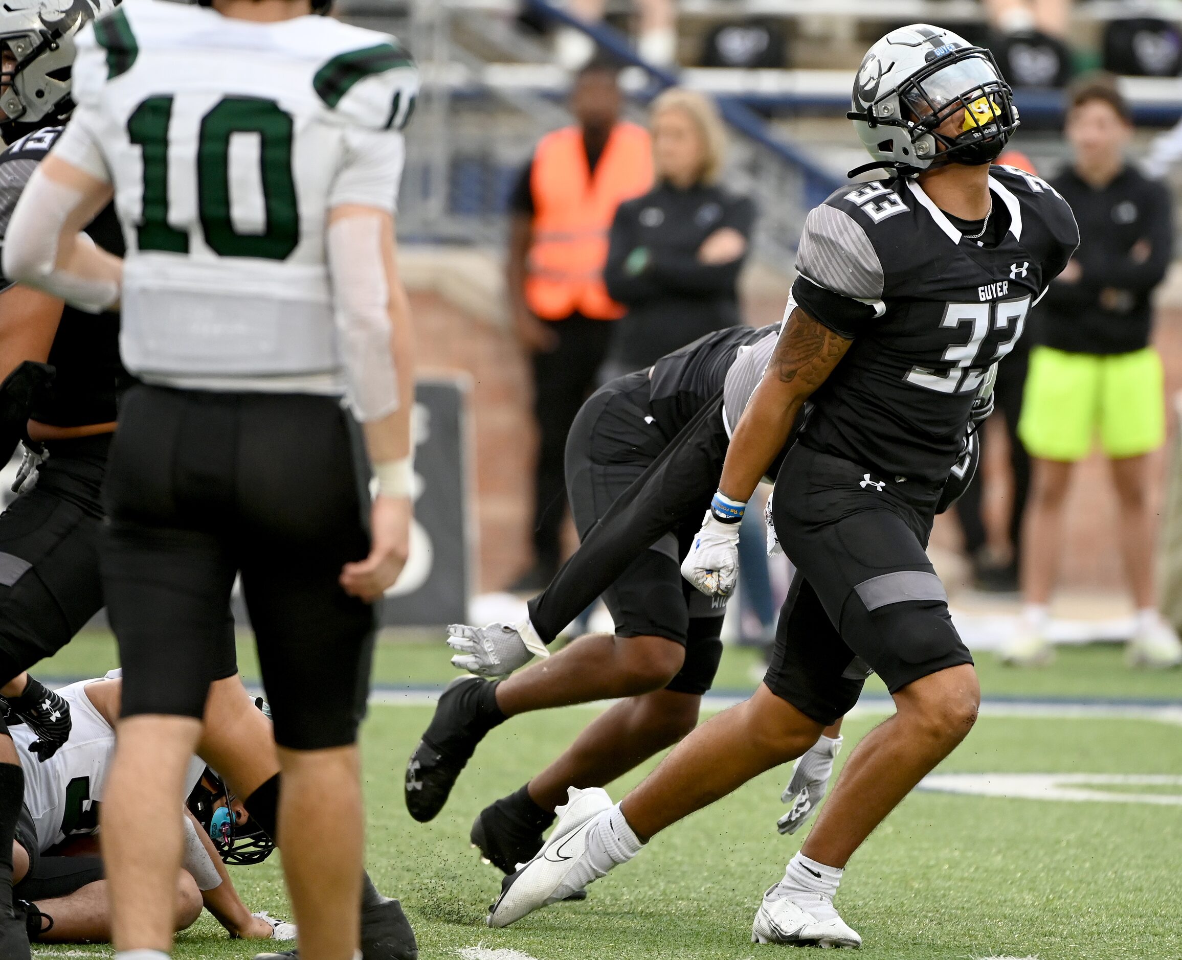 Denton Guyer's Marquan Pope (33) celebrates after a defensive stop in the second half of a...