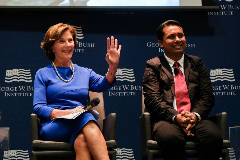 Aung Kyaw Moe, shown here in 2017 with former first lady Laura Bush, recently spoke at the...