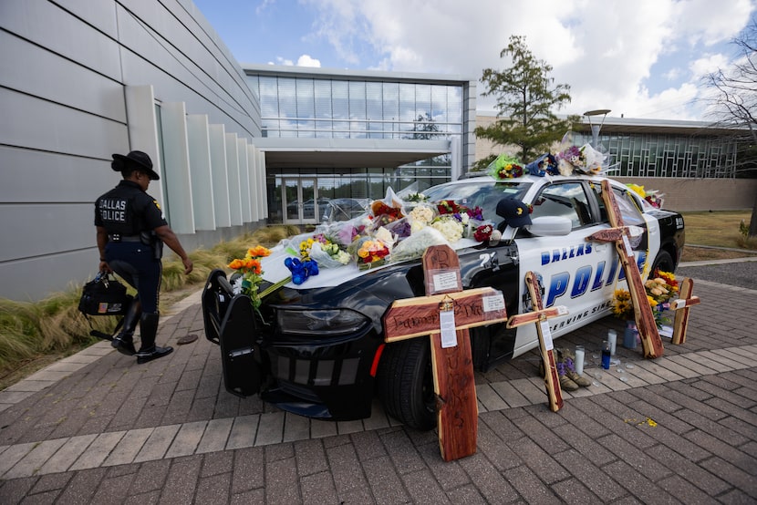 A Dallas Police Department patrol car serves as a memorial outside of the south central...